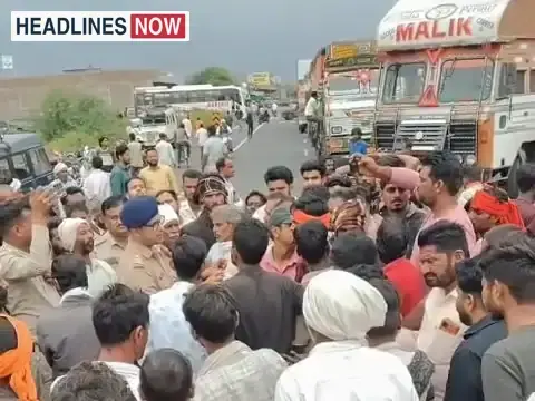 Family members blocking the highway following the youth's death, demanding driver identification and inclusion in the case in Shivpuri